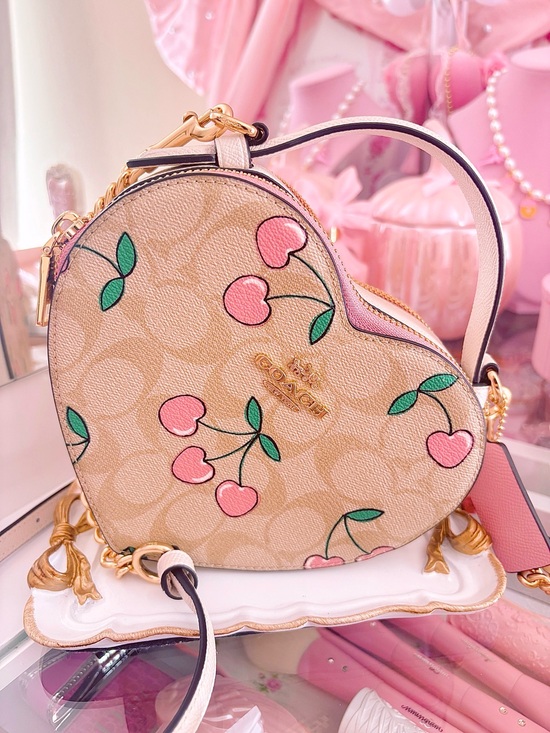 Coach Handbags - Coach Beige Signature Heart Crossbody with Pink Cherry Print